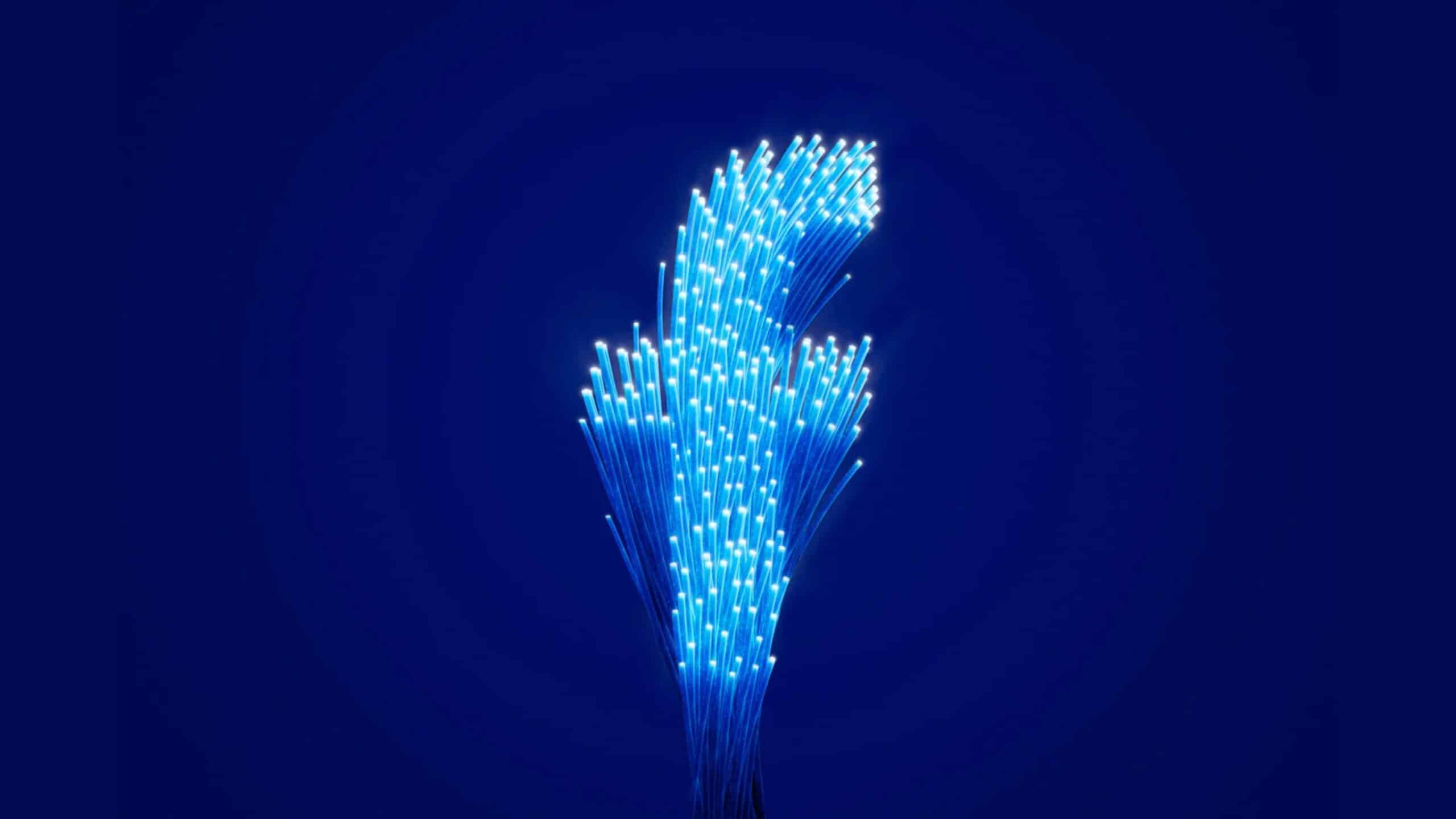 Imagem com logomarca do facebook em feixes de luz