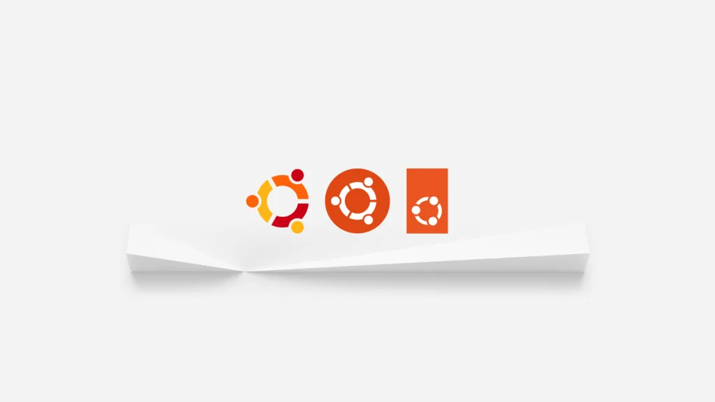 Wallpaper mostrando a evolução do logotipo do Ubuntu ao longo dos anos, em um fundo branco com três versões do logotipo em diferentes cores.