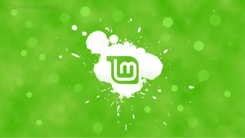 Logo do Linux Mint ao centro com um fundo verde e alguns circulos verde claro em contraste com o fundo.