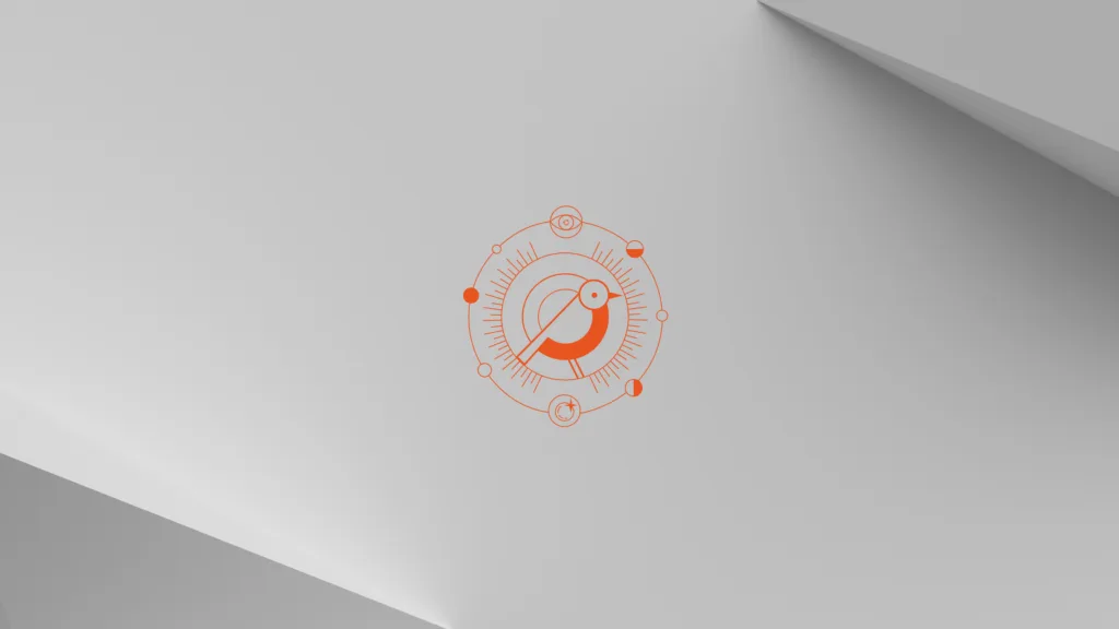 Wallpaper do Ubuntu 24.10 com fundo claro, apresentando o mascote Oriole em laranja no centro, cercado por um design geométrico minimalista.