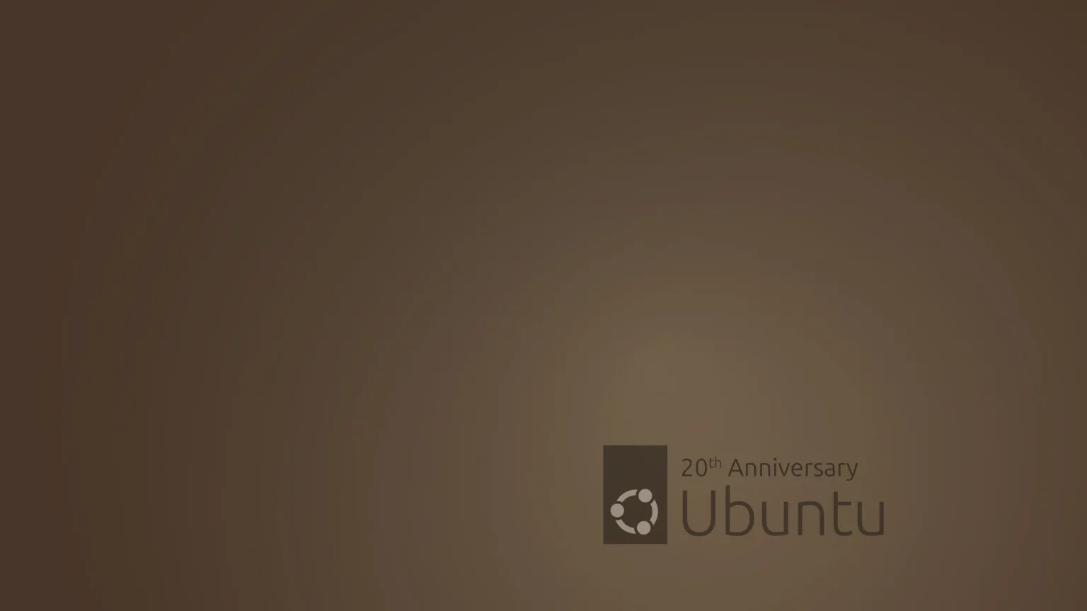 Ubuntu celebra 20 anos com novos wallpapers nostálgicos no Ubuntu 24.10 1 Wallpaper de 20º aniversário do Ubuntu, com fundo marrom e o logotipo do Ubuntu acompanhado do texto '20th Anniversary'.