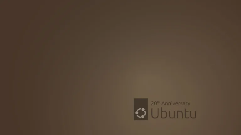 Wallpaper de 20º aniversário do Ubuntu, com fundo marrom e o logotipo do Ubuntu acompanhado do texto '20th Anniversary'.