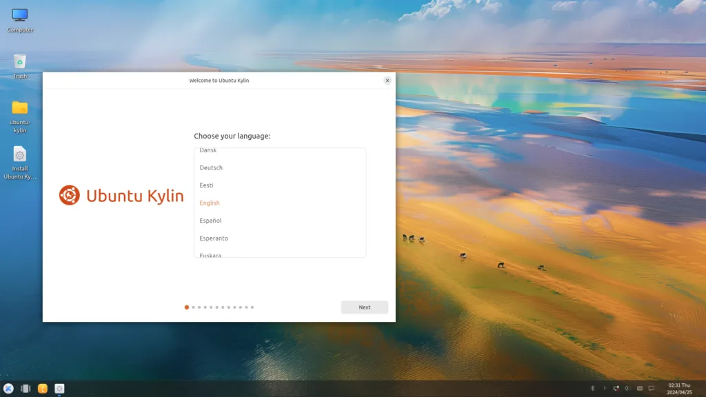 Tela de boas-vindas do instalador do Ubuntu Kylin 24.10, com a opção de escolha de idioma apresentada na interface gráfica, destacando o logotipo do Ubuntu Kylin à esquerda e o fundo do ambiente desktop.