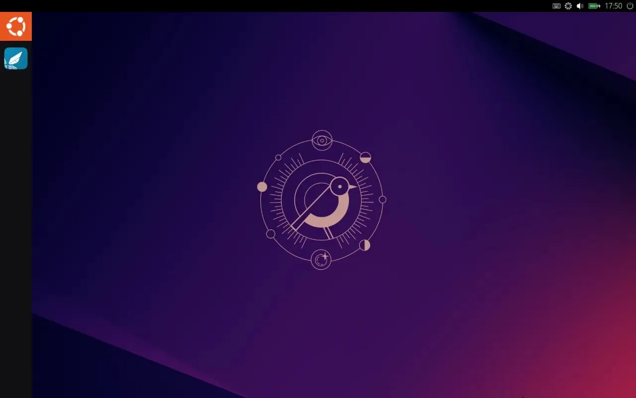 Ubuntu Unity 24.10 lançado com melhorias no Unity e parceria com HelloTux 2 Tela inicial do Ubuntu Lomiri 24.10 com o fundo padrão e ícone central do sistema.