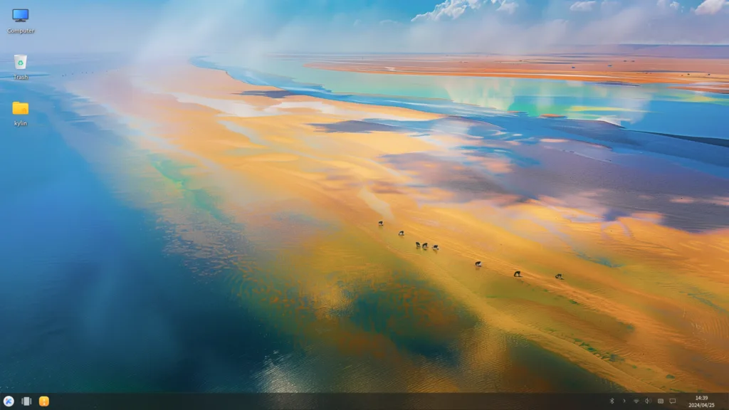 Ambiente de desktop do Ubuntu Kylin 24.10, com papel de parede de paisagem natural com cores vivas. Ícones como 'Computador', 'Lixeira' e 'Kylin' são exibidos à esquerda, e a barra de tarefas está localizada na parte inferior da tela.