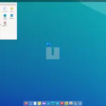 Captura de tela da interface do Voyager 24.10 mostrando o desktop com barra de aplicativos na parte inferior e menu de aplicativos aberto no canto superior esquerdo