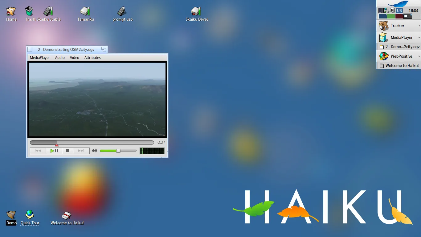Haiku amplia suporte a hardware e traz melhorias ao kernel 2 Captura de tela do sistema operacional Haiku mostrando o MediaPlayer em execução e ícones de aplicativos na área de trabalho.
