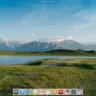 Tela inicial do elementary OS 8 com papel de parede de paisagem e dock exibindo ícones de aplicativos.