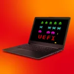 Imagem de destaque representando uma ameaça de segurança ao sistema UEFI, com um laptop exibindo gráficos pixelados de invasores no estilo de jogos retro, reforçando o tema de vulnerabilidade cibernética no Linux e o surgimento do bootkit Bootkitty.