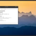 Captura de tela do sistema GhostBSD 24.10.1, exibindo o monitor do sistema com informações detalhadas sobre o hardware, incluindo o processador AMD Ryzen 7 2700X, 7.9 GB de memória, e o ambiente gráfico MATE 1.26.0. O plano de fundo apresenta montanhas sob um céu alaranjado ao pôr do sol.