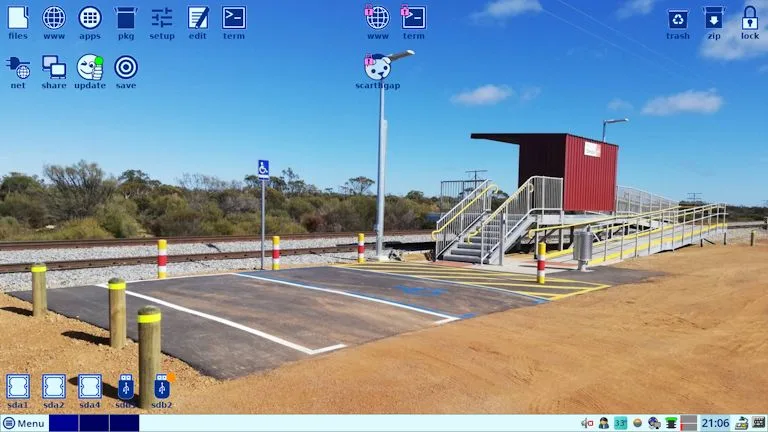 plano de fundo padrão do EasyOS Scarthgap 6.5, com uma foto de uma estação de trem rural na Austrália, simbolizando simplicidade e tranquilidade no design do sistema.