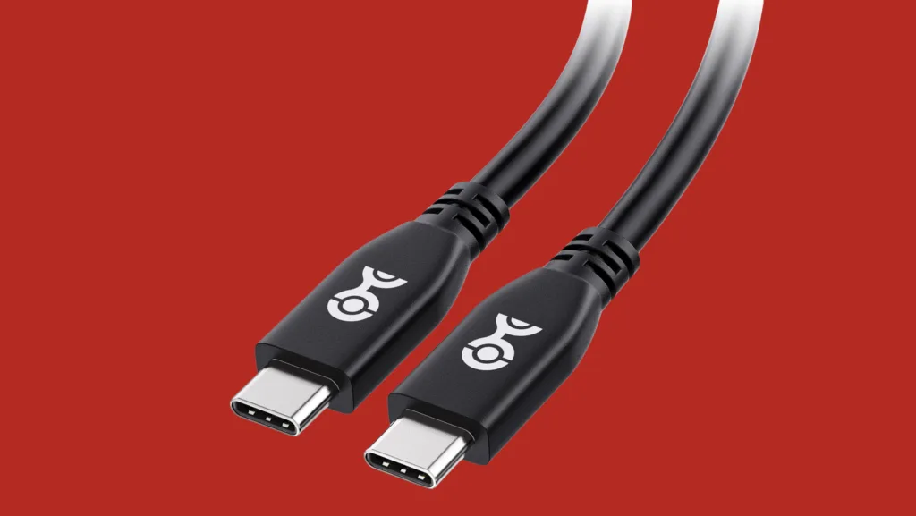 Dois cabos USB-4 pretos com conectores metálicos sobre fundo vermelho