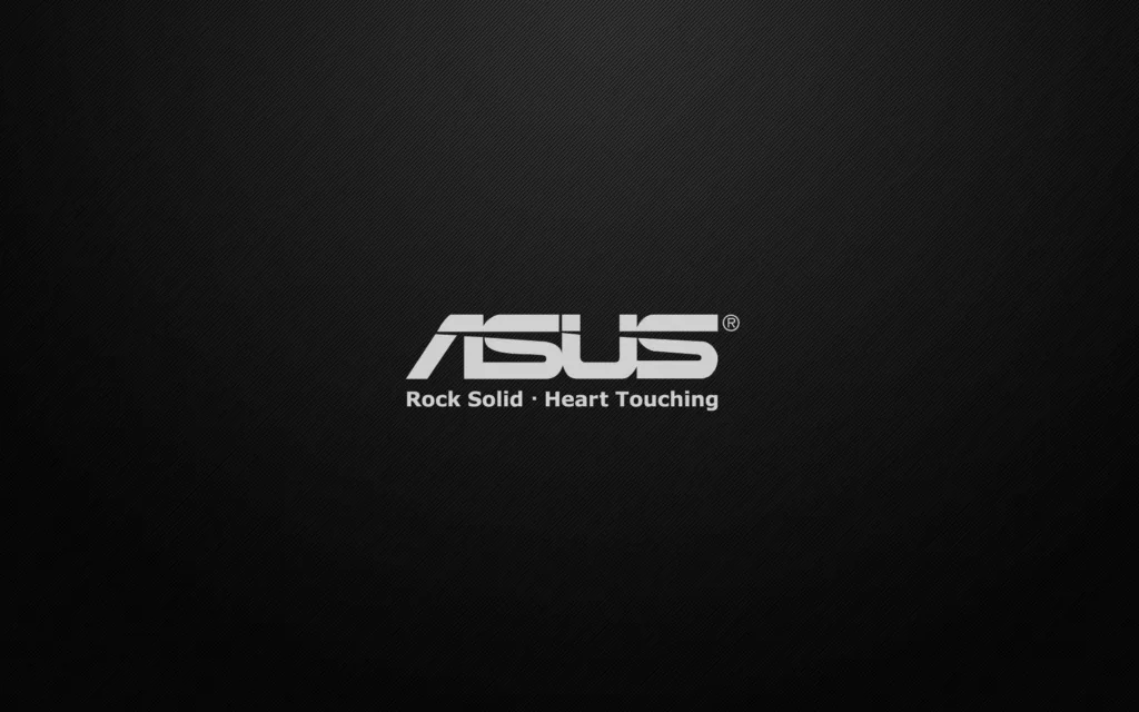 Logo da ASUS com o slogan 'Rock Solid, Heart Touching' sobre um fundo preto texturizado.