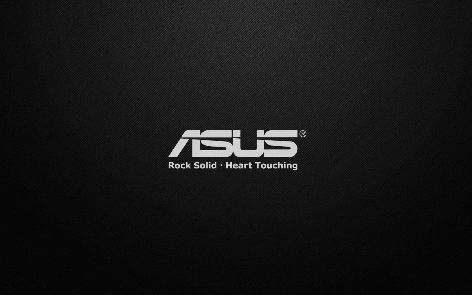 ASUS TUF Gaming X670E Plus com suporte aos sensores no Linux 6.14 1 Logo da ASUS com o slogan 'Rock Solid, Heart Touching' sobre um fundo preto texturizado.