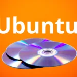 CDs reluzentes do Ubuntu sobre fundo laranja vibrante — referência ao bug do CD de graça Ubuntu