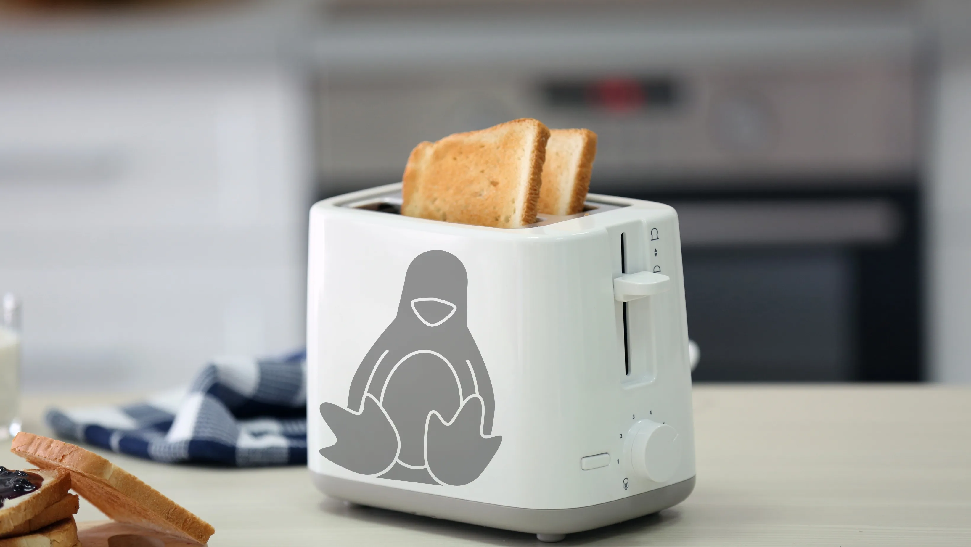 Torradeira branca com o mascote Tux do Linux, simbolizando o conceito de Linux em torradeira