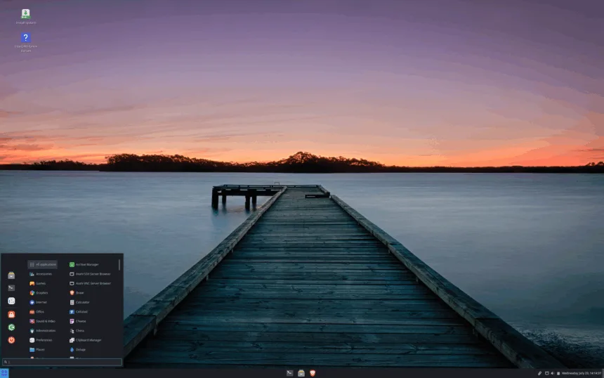 Área de trabalho padrão do Liya Linux 2.4 “Shravya” com papel de parede de pôr do sol, painel inferior e menu de aplicativos aberto