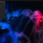 Screenshot do PorteuX 2.2 com o menu de aplicativos aberto em um ambiente desktop leve, sobre um papel de parede abstrato de fumaça azul e rosa